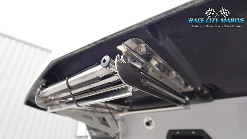 Slide: The Image of 2025 Nautique Super Air Nautique G23 boat exhaust detail, Race City Marine logo visible. - 11