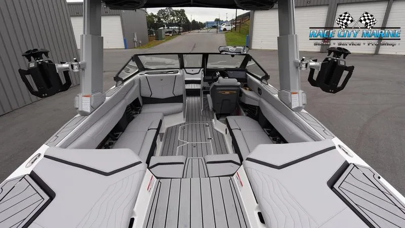 Slide: The Image of 2025 Nautique Super Air Nautique G23 interior, sleek design, spacious seating, advanced features. - 15