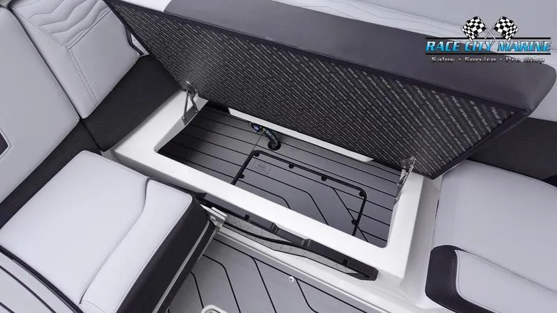 Slide: The Image of 2025 Nautique Super Air Nautique G23 boat interior storage compartment. - 25