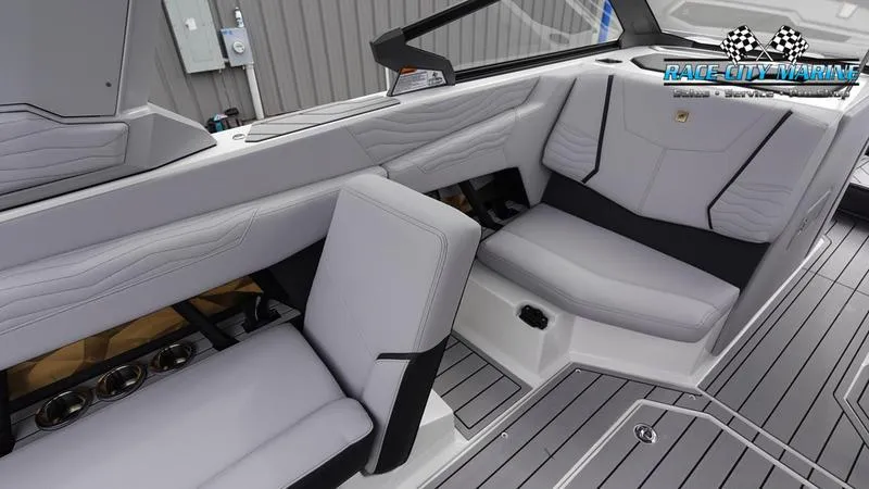 Slide: The Image of 2025 Nautique Super Air Nautique G23 interior with sleek, modern seating and stylish design. - 27