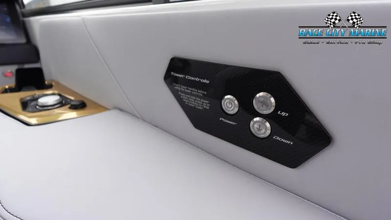 Slide: The Image of 2025 Nautique Super Air Nautique G23 interior control panel with buttons. - 34