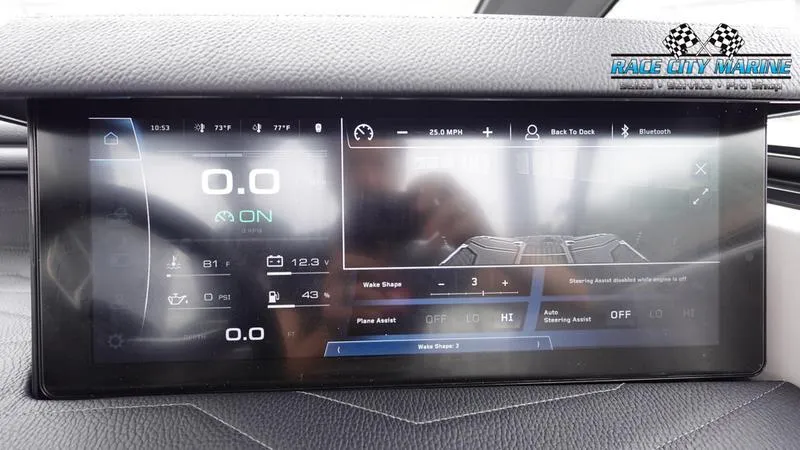 Slide: The Image of 2025 Nautique Super Air Nautique G23 dashboard display with digital controls and settings. - 37