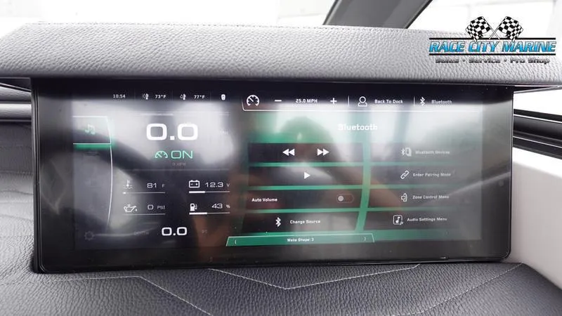 Slide: The Image of 2025 Nautique Super Air Nautique G23 dashboard display with digital controls and Race City Marine logo. - 38