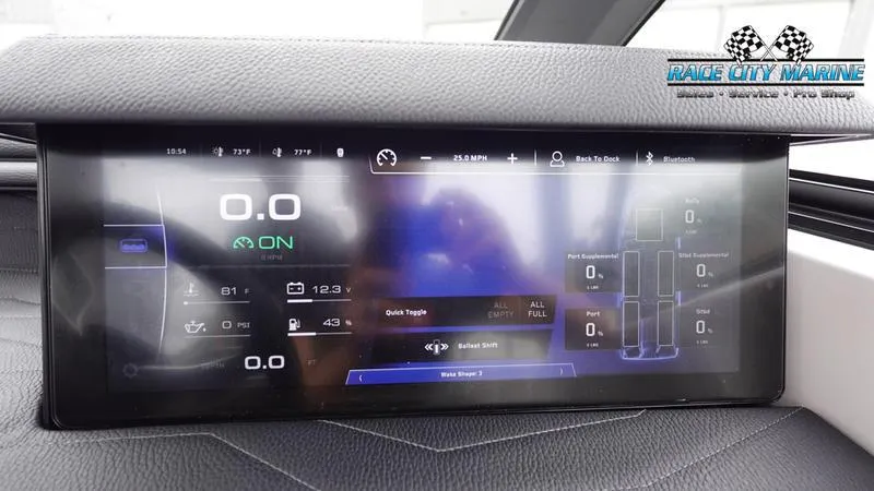 Slide: The Image of 2025 Nautique Super Air Nautique G23 dashboard display with digital controls and navigation. - 39