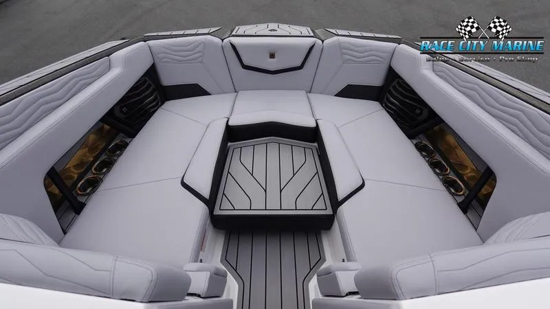 Slide: The Image of 2025 Nautique Super Air Nautique G23 interior with luxurious seating and sleek design. - 45