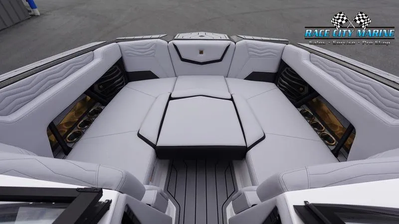 Slide: The Image of 2025 Nautique Super Air Nautique G23 boat interior with luxurious seating and sleek design. - 46