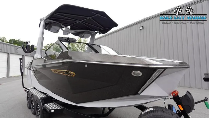 Slide: The Image of 2025 Nautique Super Air Nautique G23 boat at Race City Marine dealership. - 5