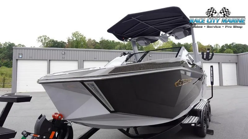 Slide: The Image of 2025 Nautique Super Air Nautique G23 boat at Race City Marine dealership. - 6