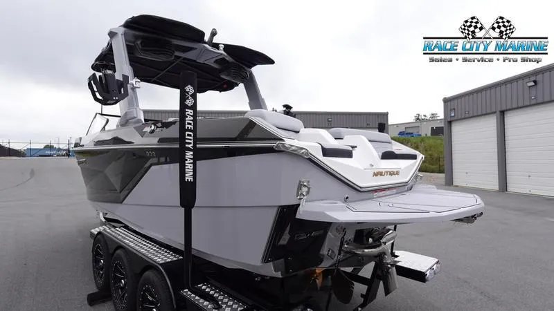 Slide: The Image of 2025 Nautique Super Air Nautique G23 boat at Race City Marine dealership. - 7