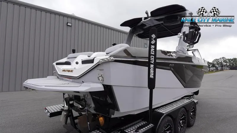 Slide: The Image of 2025 Nautique Super Air Nautique G23 boat on trailer at Race City Marine. - 8