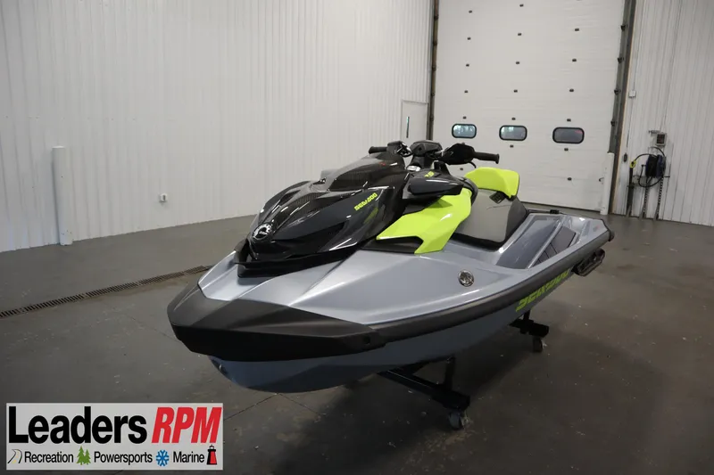 The Image of 2025 Sea-Doo RXP-X™ 325 iBR in Ice Metal and Manta Green, displayed indoors. - 1