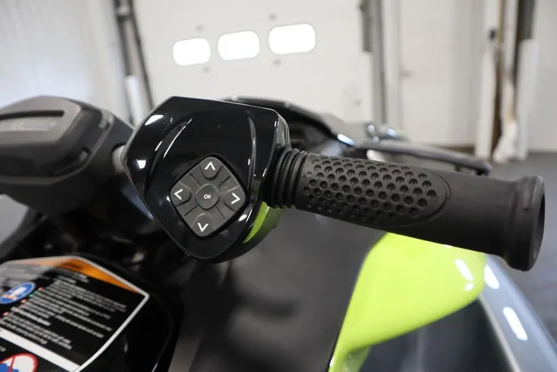 Slide: The Image of 2025 Sea-Doo RXP-X 325 handlebar with control buttons, featuring ergonomic grip design. - 14
