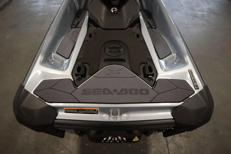 Slide: The Image of 2025 Sea-Doo RXP-X 325 jet ski, rear view, showcasing sleek design and branding. - 22