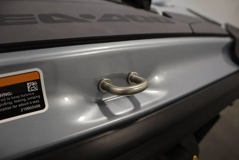 Slide: The Image of 2025 Sea-Doo RXP-X 325 close-up showing handle and warning label. - 23