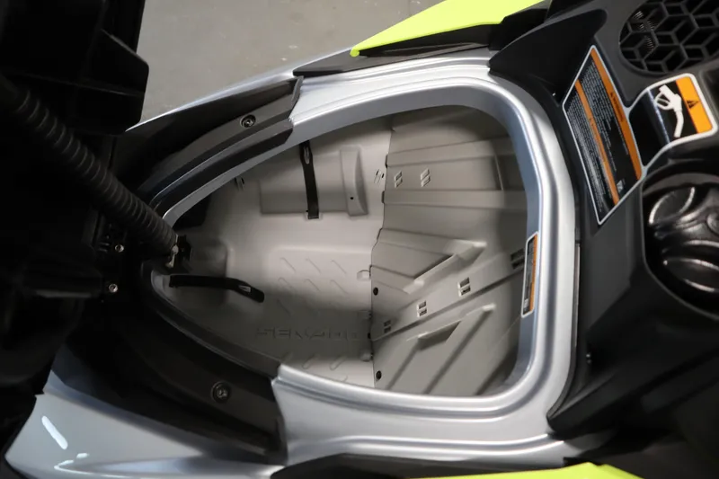 Slide: The Image of 2025 Sea-Doo RXP-X™ 325 iBR storage compartment, Ice Metal and Manta Green design. - 6