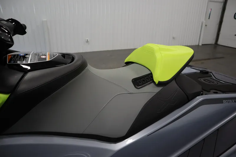 Slide: The Image of 2025 Sea-Doo RXP-X™ 325 iBR in Ice Metal and Manta Green, featuring sleek seat design. - 9