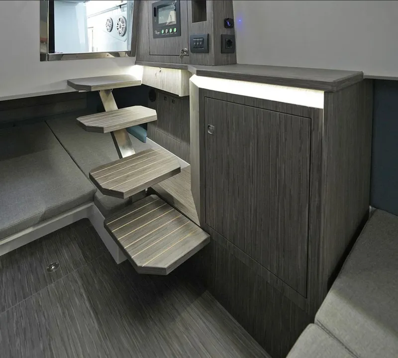 Slide: The Image of Interior of 2025 Ranieri Cayman 33 Executive yacht with modern wooden steps and cabinetry. - 23