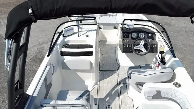 Slide: The Image of 2023 Bayliner VR6 Bowrider Outboard on water, sleek design, modern features. - 4