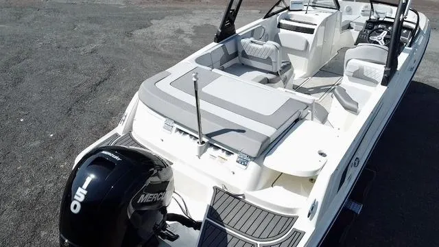 Slide: The Image of 2023 Bayliner VR6 Bowrider Outboard, aerial view, spacious seating, sleek design. - 5