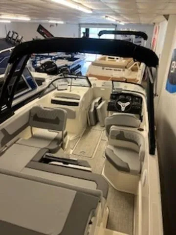 Slide: The Image of 2023 Bayliner VR6 Bowrider Outboard interior with modern dashboard and seating. - 6