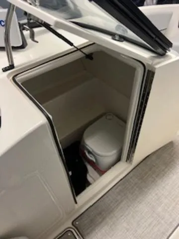 Slide: The Image of 2023 Bayliner VR6 Bowrider with outboard motor, featuring spacious seating and modern design. - 7