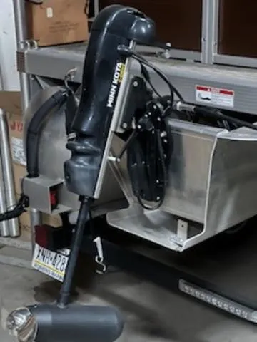 Slide: The Image of 2022 Bennington 168 SF boat with Minn Kota trolling motor in a garage. - 6