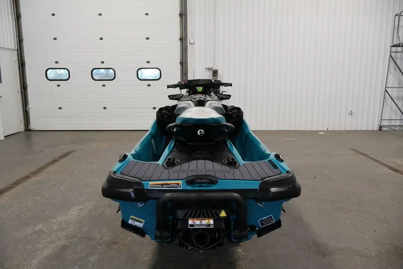 Slide: The Image of 2026 Sea-Doo GTX Limited 325 jet ski in a garage, rear view. - 10