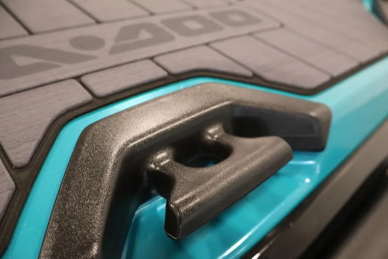 Slide: The Image of Close-up of 2026 Sea-Doo GTX Limited 325 deck with teal and black detailing. - 19