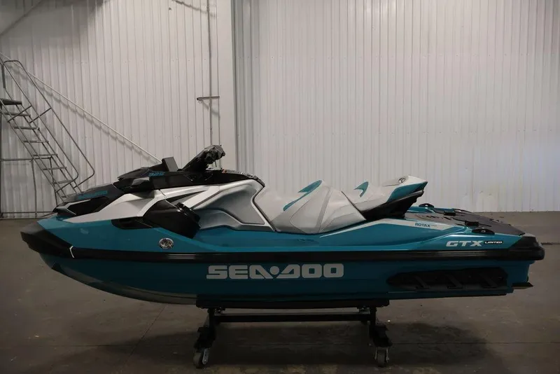 Slide: The Image of 2026 Sea-Doo GTX Limited 325 jet ski in a showroom, side view. - 3