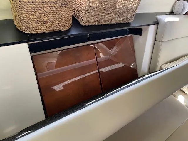 Slide: The Image of Interior of 2018 Regal 35 Sport Coupe with wooden cabinets and woven baskets. - 40