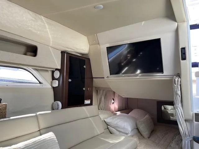 Slide: The Image of Interior of 2018 Regal 35 Sport Coupe with TV, sofa, and bed. - 41