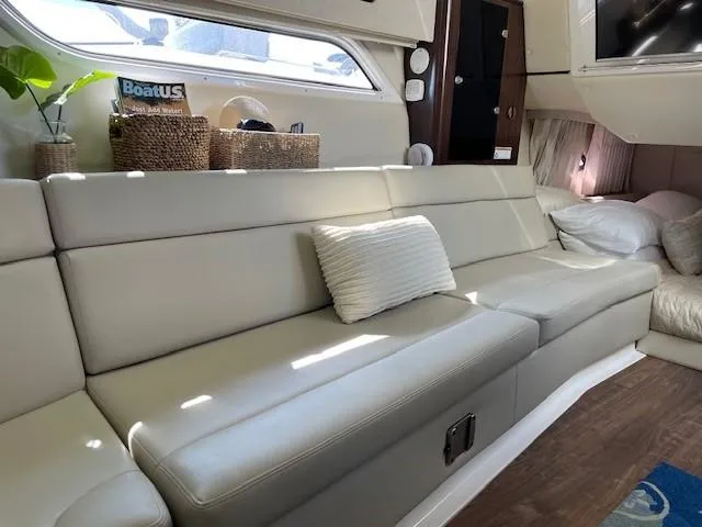 Slide: The Image of Interior of 2018 Regal 35 Sport Coupe with beige leather seating and decorative pillows. - 42