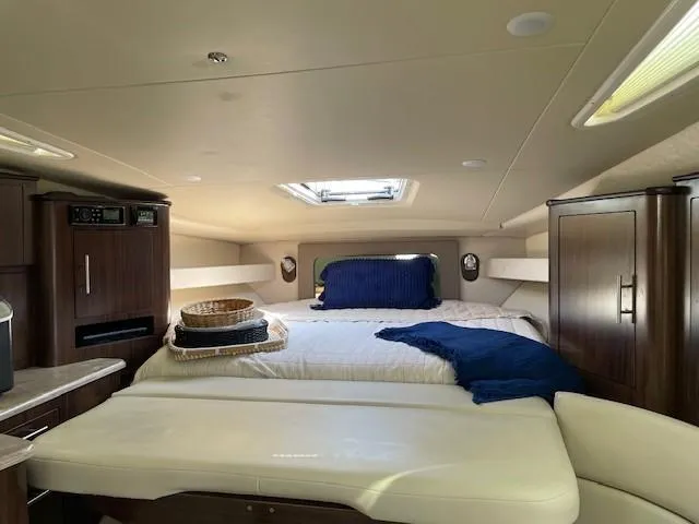 Slide: The Image of Luxurious interior of 2018 Regal 35 Sport Coupe with cozy bed and elegant wood cabinetry. - 49