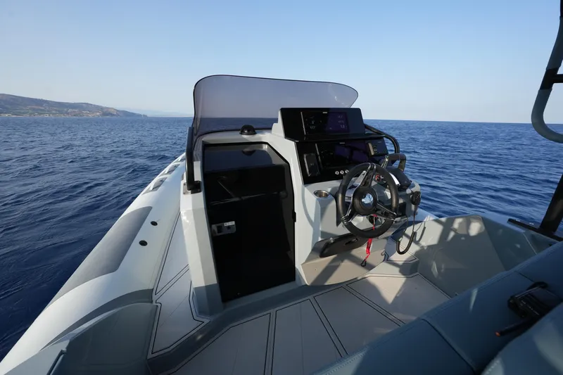Slide: The Image of 2025 Ranieri Cayman 33 Executive boat dashboard on open sea. - 22