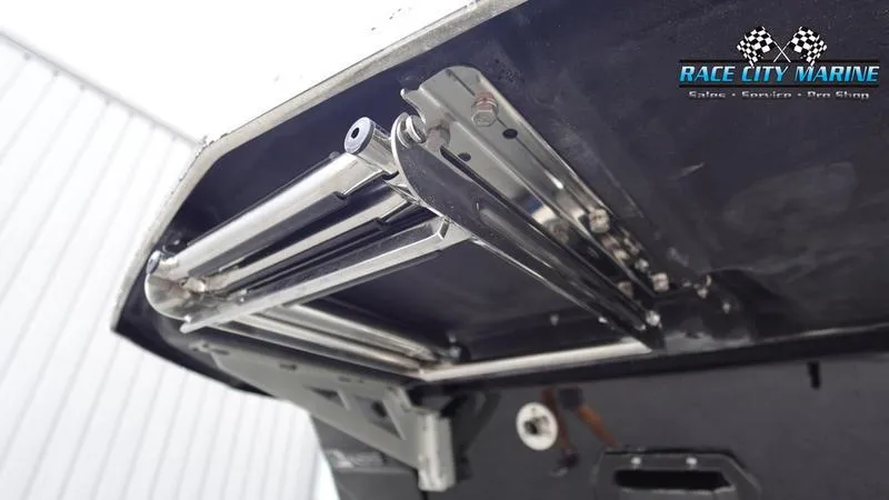 Slide: The Image of 2025 Nautique Super Air Nautique G25 boat ladder mechanism, Race City Marine branding. - 11