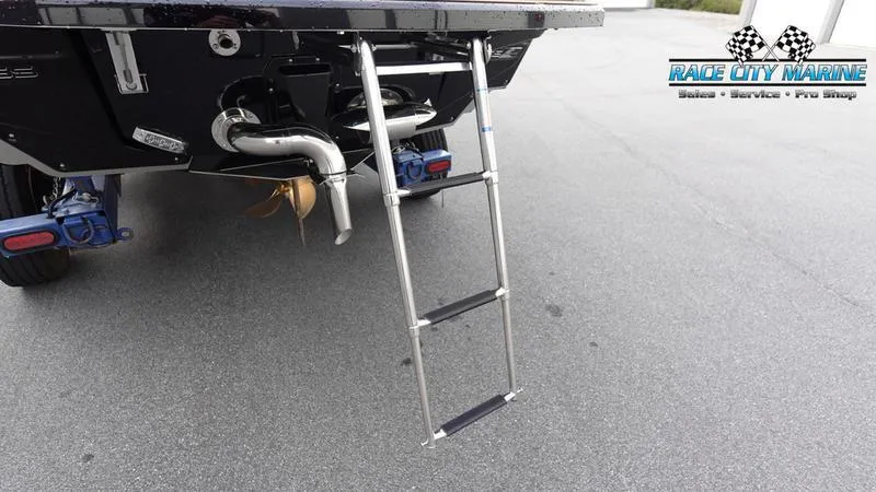 Slide: The Image of 2025 Nautique Super Air Nautique G25 boat with rear ladder and Race City Marine logo. - 12