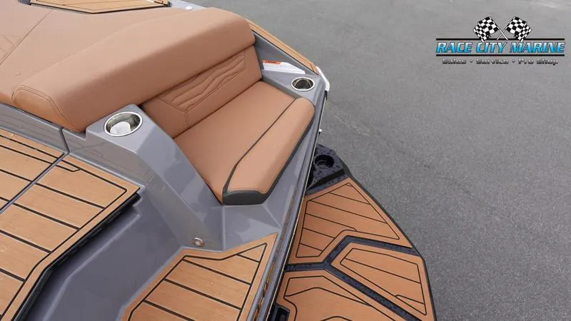 Slide: The Image of 2025 Nautique Super Air Nautique G25 boat with tan seating and deck. - 15