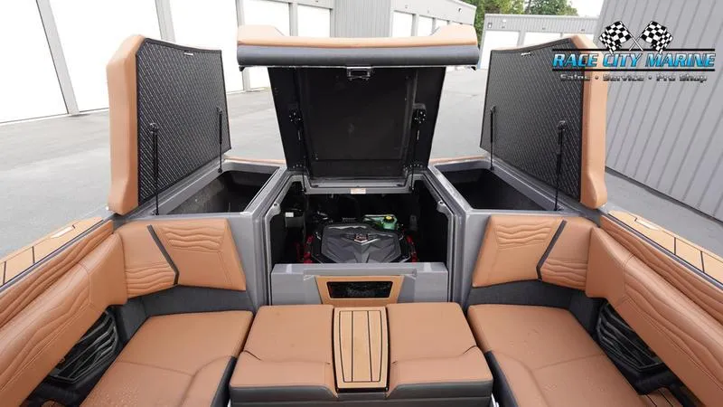 Slide: The Image of 2025 Nautique Super Air Nautique G25 interior storage compartments open. - 18