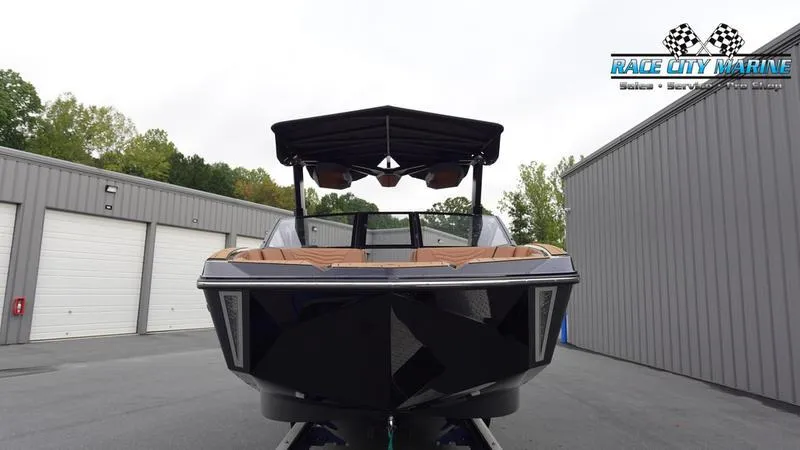 Slide: The Image of 2025 Nautique Super Air Nautique G25 boat at Race City Marine dealership. - 3