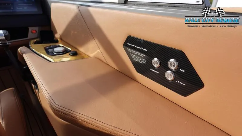 Slide: The Image of 2025 Nautique Super Air Nautique G25 interior with control panel and premium leather finish. - 35