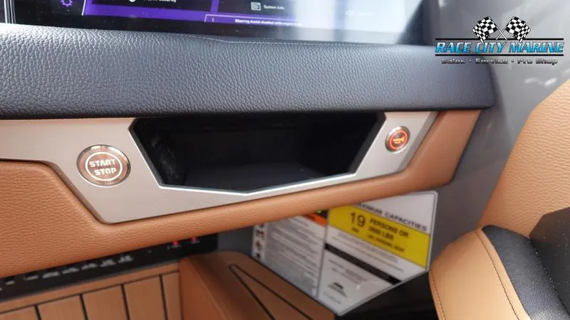 Slide: The Image of 2025 Nautique Super Air Nautique G25 dashboard with start/stop button and Race City Marine logo. - 44