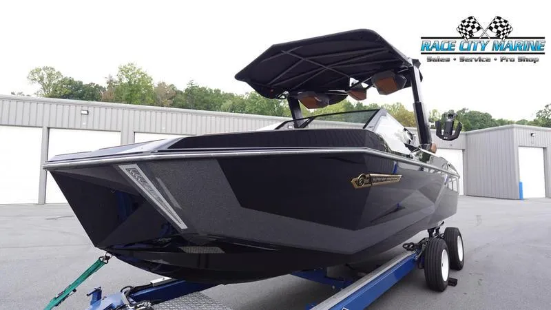 Slide: The Image of 2025 Nautique Super Air Nautique G25 boat on trailer at Race City Marine. - 6