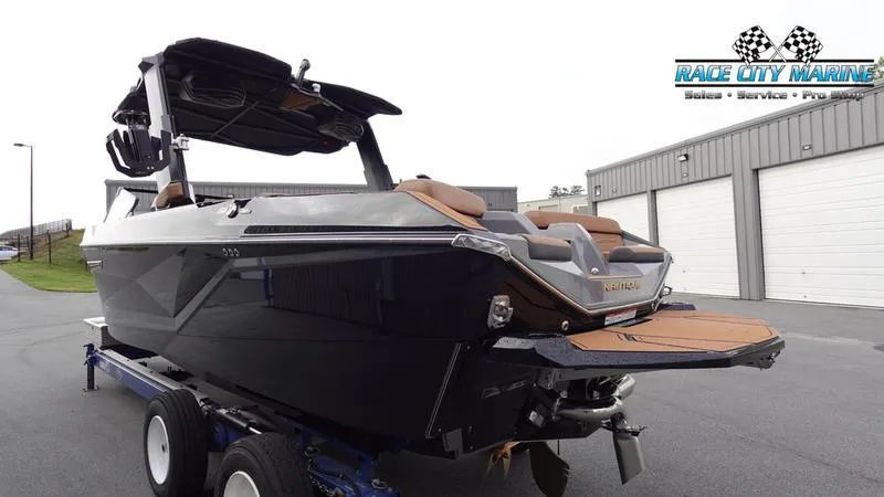 Slide: The Image of 2025 Nautique Super Air Nautique G25 boat on trailer at Race City Marine. - 7