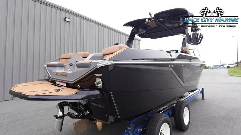 Slide: The Image of 2025 Nautique Super Air Nautique G25 boat on trailer at Race City Marine. - 8