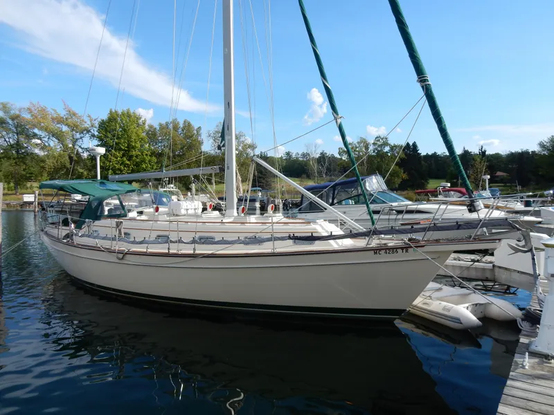The Image of 1997 Island Packet 40 sailboat docked at a marina on a sunny day. - 0