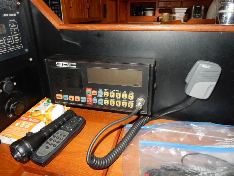 Slide: The Image of Radio equipment and controls inside a 1997 Island Packet 40 sailboat cabin. - 21