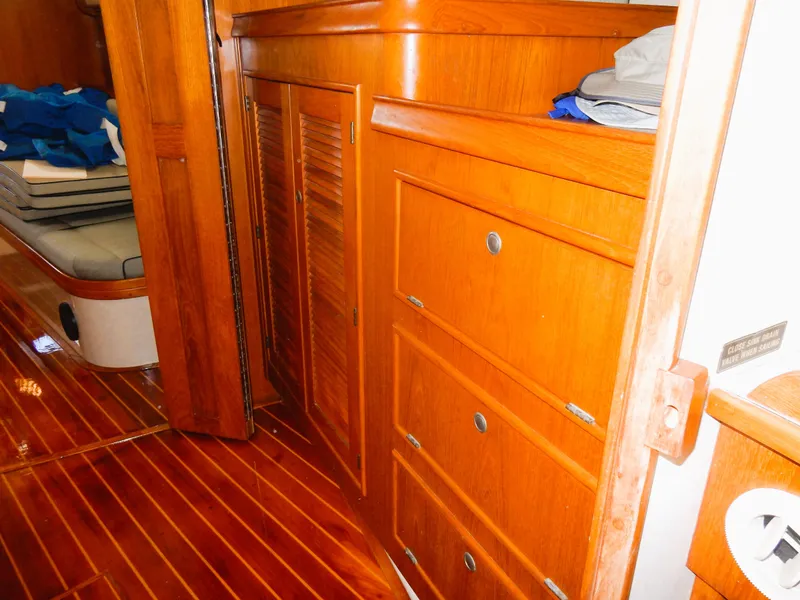Slide: The Image of Interior of 1997 Island Packet 40 sailboat with wooden cabinetry and flooring. - 34