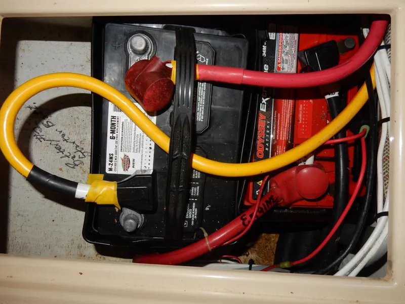 Slide: The Image of Battery compartment of a 1997 Island Packet 40 sailboat with cables and connections. - 43
