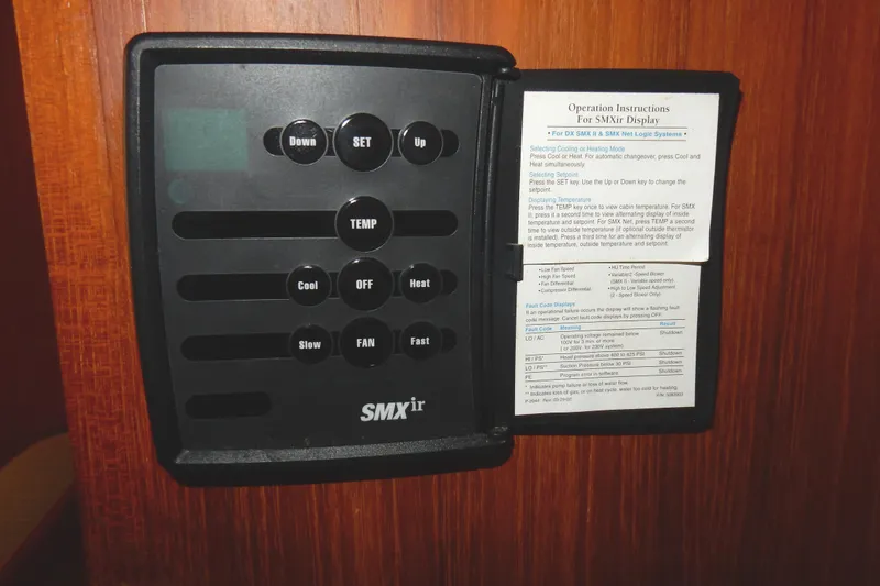 Slide: The Image of Control panel of a 1997 Island Packet 40 sailboat with operation instructions. - 46