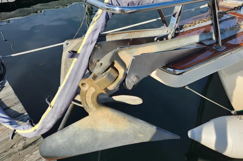 Slide: The Image of Anchor of a 1997 Island Packet 40 sailboat, docked at a marina. - 48